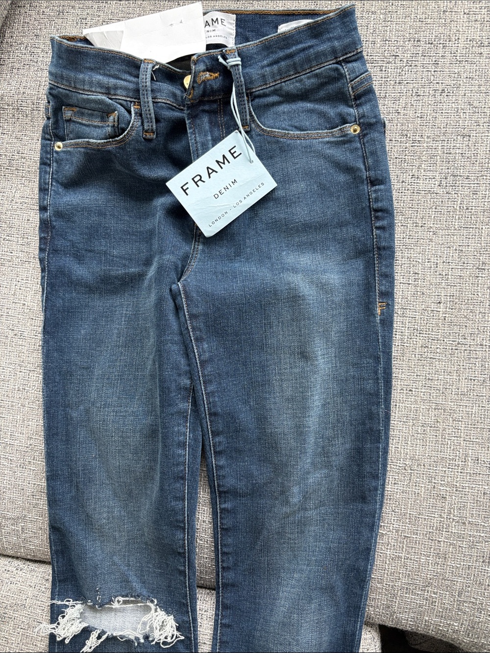 Frame Denim Women's Dark Blue Skinny Jeans with Distressed Hem